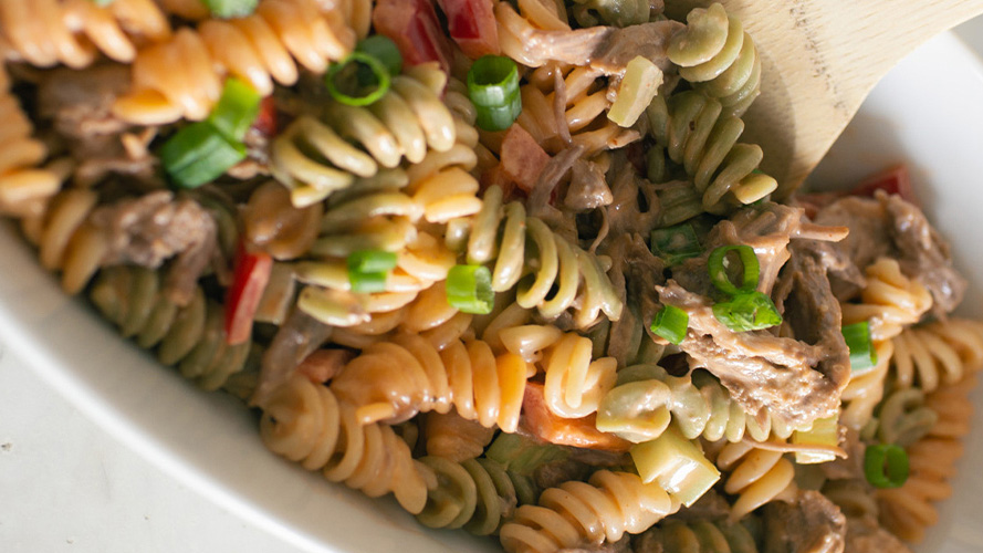 Dorothy Lynch Pulled Pork Pasta Salad in a white serving bowl
