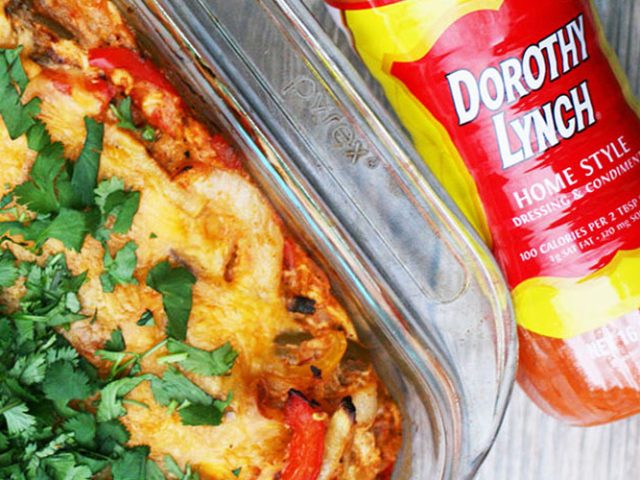 Chicken Fajita Bake in a clear pyrex pan with a Dorothy Lynch bottle laying beside