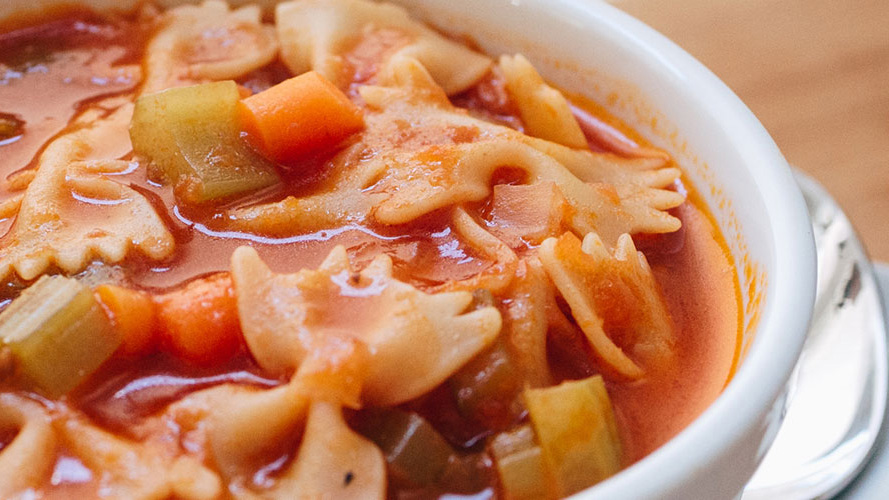 Tomato Bowtie Pasta Soup in a white bowl