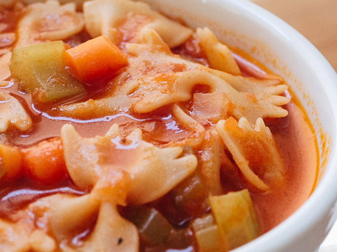 Tomato Bowtie Pasta Soup in a white bowl