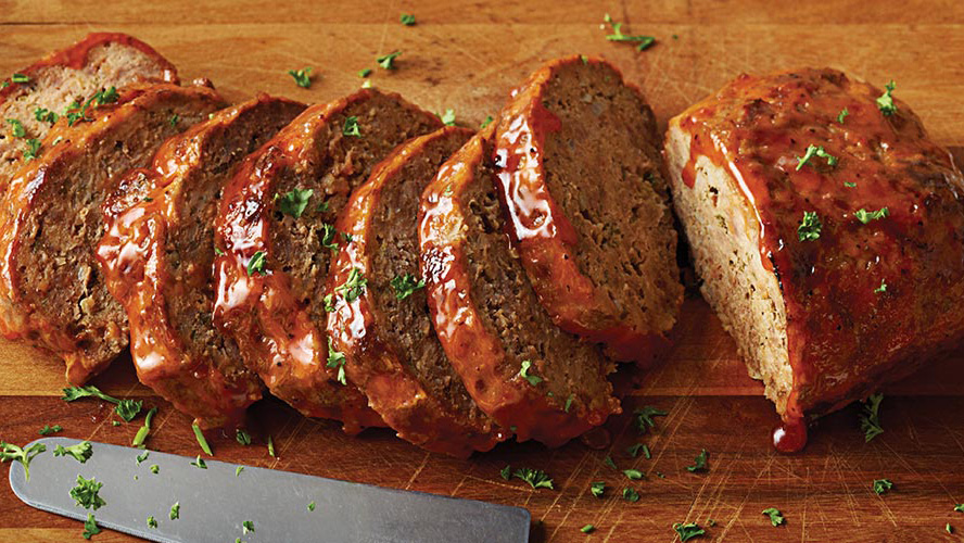 Dorothy Lynch Meatloaf cut up on a wooden cutting board