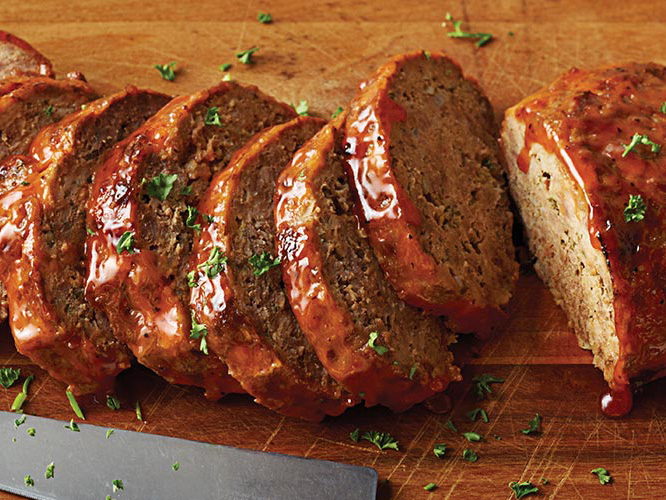 Dorothy Lynch Meatloaf cut up on a wooden cutting board