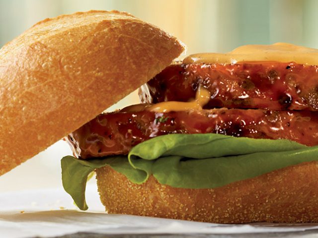 Dorothy Lynch Meatloaf Sandwich with top bun hanging off the sandwich