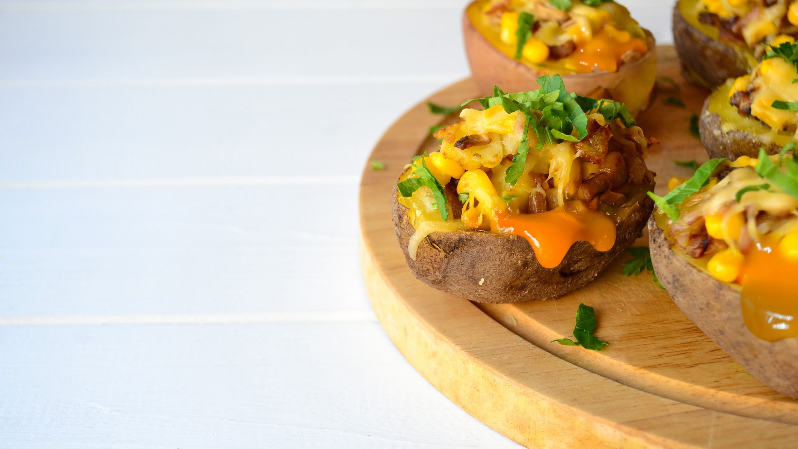 Midwest-Style Potato Skins Recipe on a wooden tray