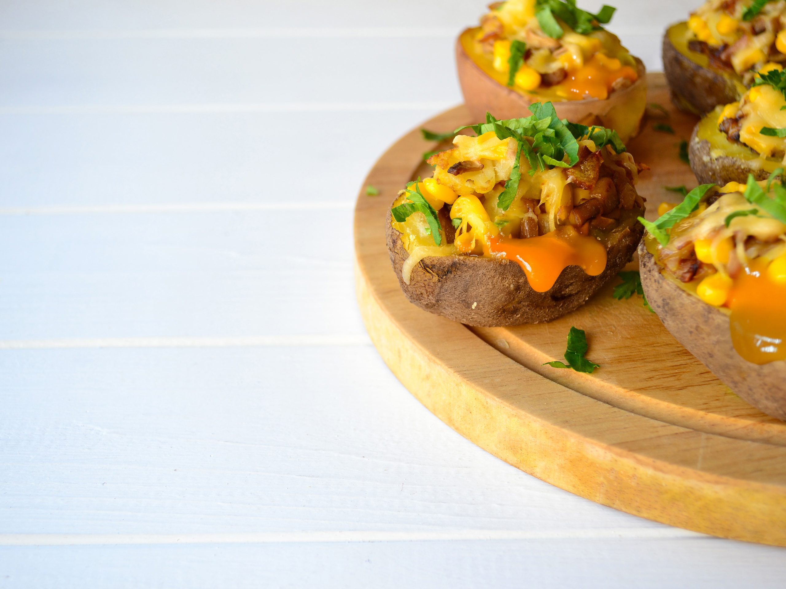 Midwest-Style Potato Skins Recipe on a wooden tray