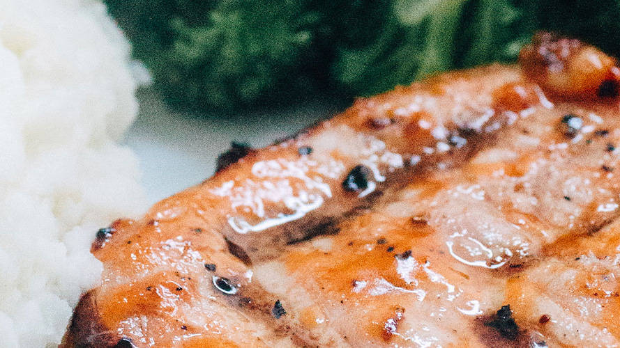 Dorothy Lynch marinated Grilled Pork Chop with rice and broccoli in frame