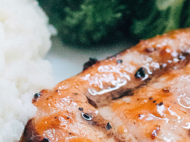 Dorothy Lynch marinated Grilled Pork Chop with rice and broccoli in frame