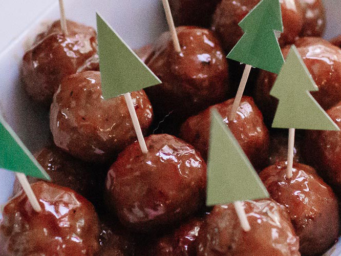 Meatballs with Dorothy Lynch Glaze that have toothpicks in them with green trees