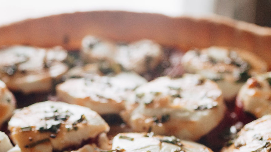 Dorothy Lynch Goat Cheese and Tomato Tarts, in a pan, out of focus