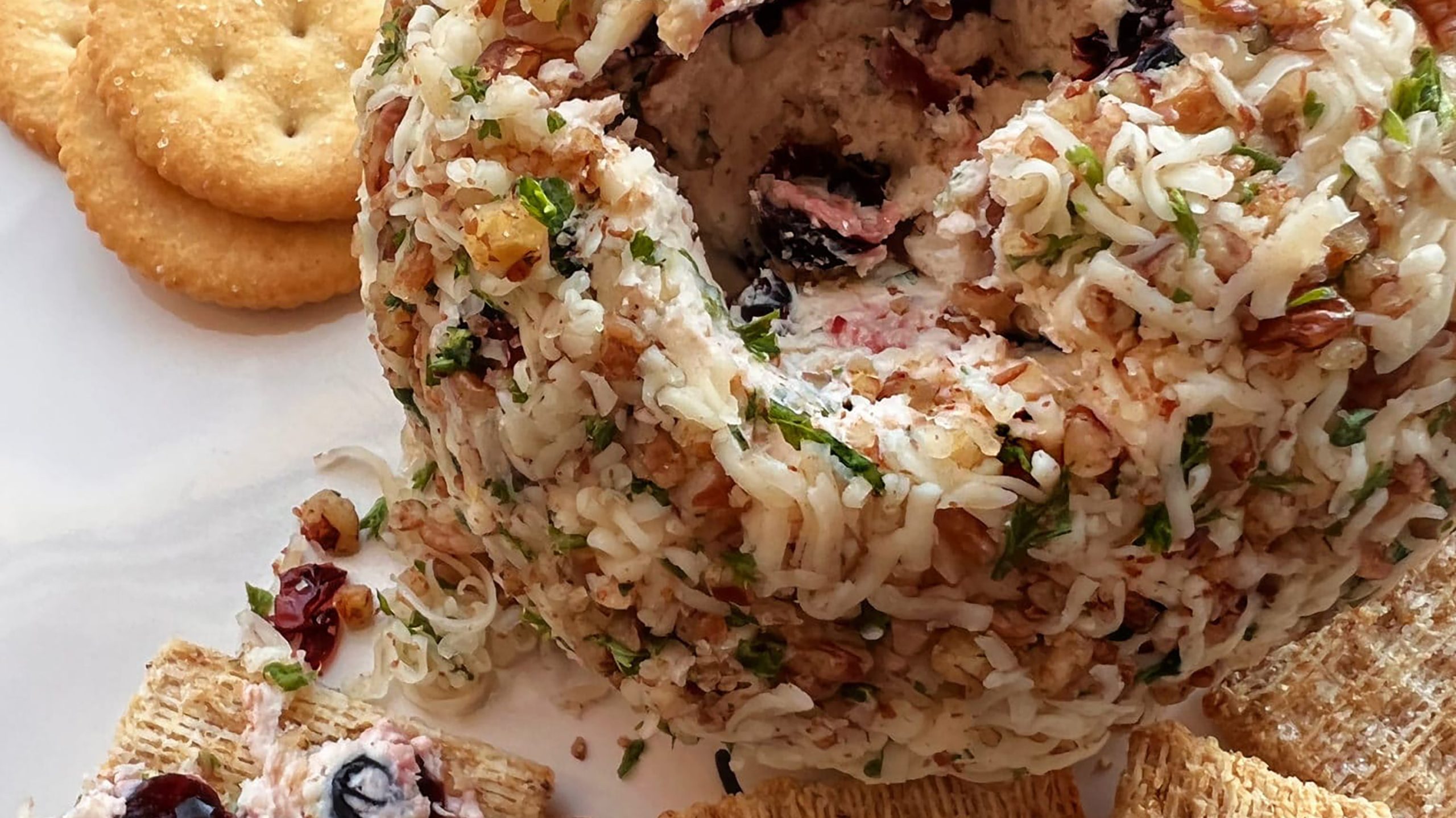 Close-up of Dorothy Lynch’s Holiday Cheese Ball with crackers