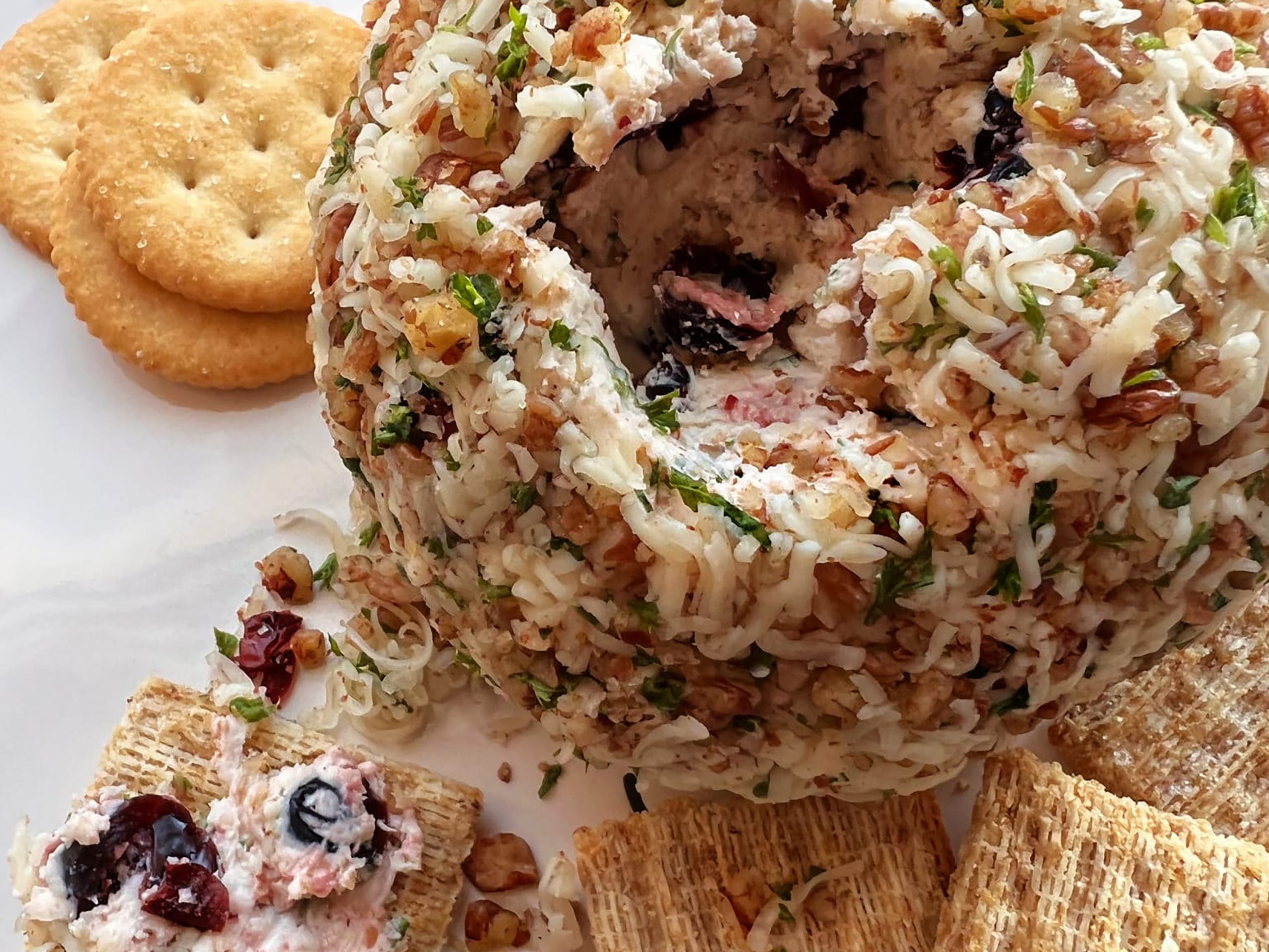 Close-up of Dorothy Lynch’s Holiday Cheese Ball with crackers
