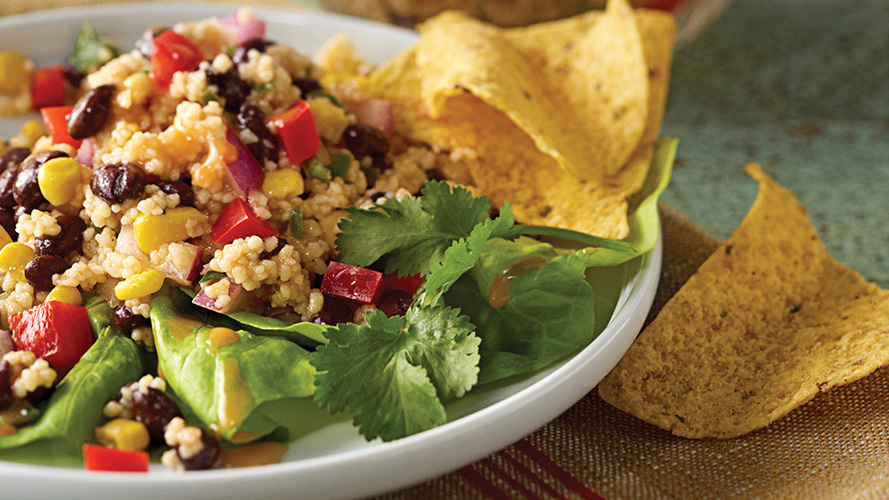 Dorothy Lynch Southwestern Coucous Recipe on white plate with chips beside