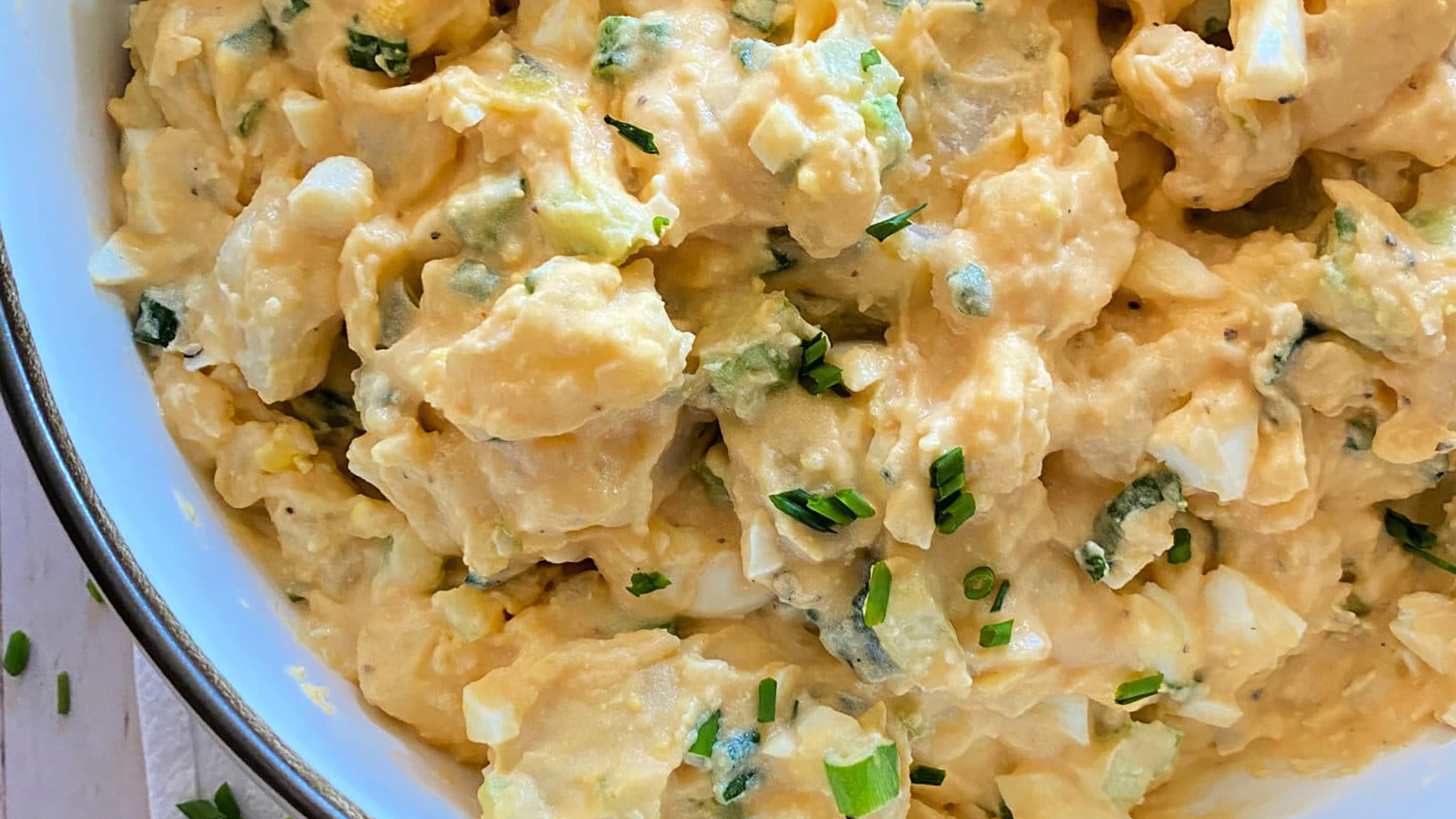 Close up of Dorothy Lynch Dressing Potato Salad in a Bowl