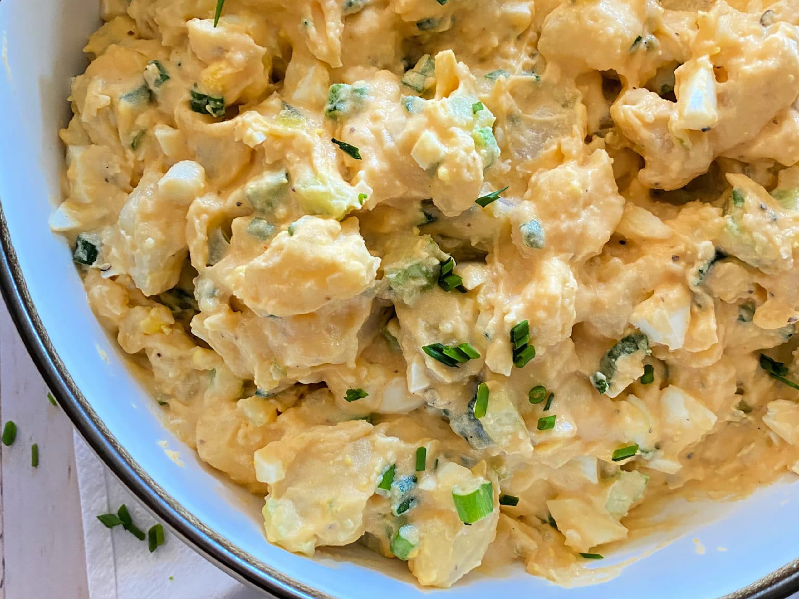Close up of Dorothy Lynch Dressing Potato Salad in a Bowl