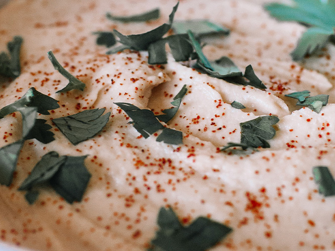 Hummus with Dorothy Lynch Home Style Recipe, pieces of cilantro on top for decoration