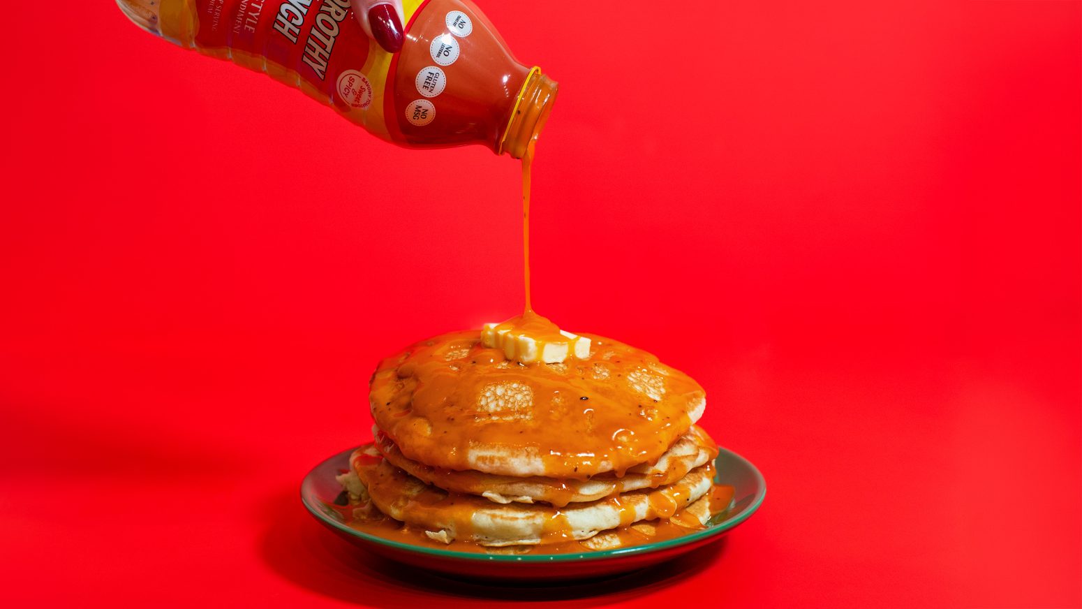 Stack of buttermilk pancakes with Dorothy Lynch Dressing drizzled over it